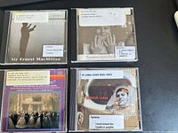Front covers of all four CDs showing titles and library labels