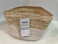 Exterior view showing two-tone jute and cotton weave with tag