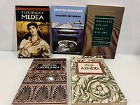 Front covers of all five books displayed upright