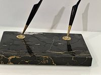 overall view of marble base and two pens