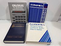 Front covers of all four textbooks visible