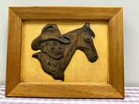 Framed wood relief artwork showing entire piece