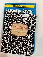 Front view of both books stacked