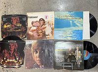 Six record jackets visible including Rod Stewart, Jose Feliciano, Janz Brothers, duplicated Rod Stewart die-cut, Anne Murray, Scottish songs LPs
