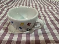 Teacup on saucer showing spiral pattern
