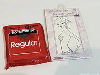 Front view of both sealed packages: No Nonsense pantyhose and Braza adhesive bra