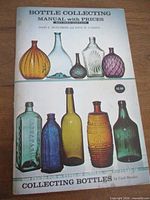 Front cover showing book title, authors, bottle images