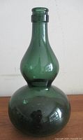 front view of emerald green gourd vase showing overall shape and color