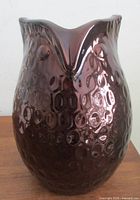 Front view of iridescent owl-shaped vase