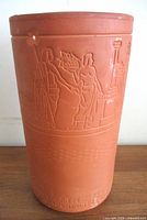 Full view of terracotta wine cooler showing relief figures and overall form
