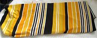 Entire folded length of striped fabric showing pattern and colors