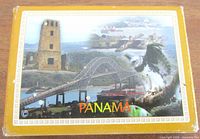 Front of golden tuck box showing Panama imagery