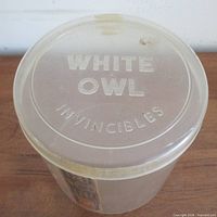 Top view showing embossed WHITE OWL INVINCIBLES on lid