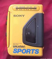 Front view showing Sony logo, WM-AF series marking, Walkman Sports branding, and AM/FM frequency scale