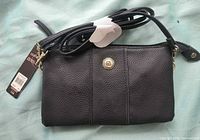 Front view of black pebbled leather Stone Mountain crossbody with strap