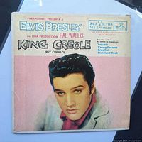Front of picture sleeve showing Elvis Presley portrait and song list