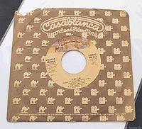 Front of record in Casablanca company sleeve showing label through die-cut.