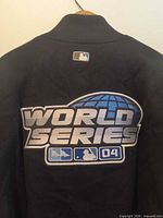 Back view showing large embroidered World Series 04 patch and MLB collar logo