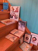Group on stairs showing all books in lot