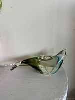 Profile view of blown glass seal figurine