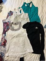 Overview of all five activewear pieces laid out