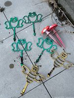 All stakes laid out: four frog, two bee, two mushroom