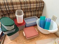 Group view of all Tupperware pieces on floor