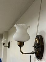 Both wall sconces mounted, showing overall look