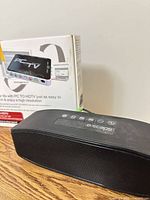 Escape Bluetooth speaker beside kworld PC to TV HD box