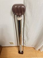 Full view of Bullworker exerciser standing upright