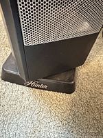 Hunter logo on base and mesh grill front of heater