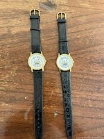 Front view of both watches showing dials, cases and full straps