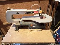 Full view of Ryobi SC163VS scroll saw on MDF stand