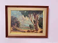 Framed oil landscape on wall