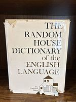 Front view showing book title and damaged dust jacket