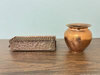 Front view of copper planter and vase side by side