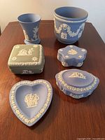 Group shot of six Wedgwood Jasperware pieces on table