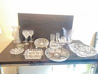 Group shot displaying all fourteen lead crystal pieces on table