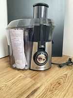Full view of assembled Hamilton Beach Big Mouth juicer showing exterior condition and power cord
