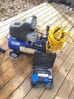 Compressor, hose, nailer in case overview
