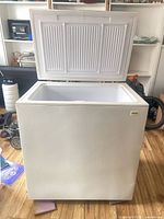 Front view of chest freezer with lid open