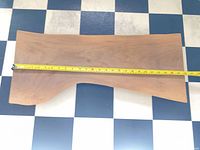 Top view showing full live edge board with tape measure across length