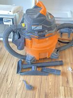 Vacuum with hose, attachments, and filter bag pack