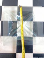 Top view of larger divided square dish with tape measure showing size