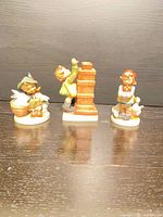 Front view of all three figurines side by side