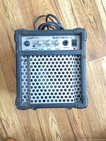 Front view of Washburn Bad Dog BD8K amplifier showing grille and control panel