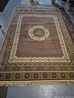 Full view of rug showing size, pattern and fringe