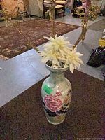 Full view of vase with artificial flowers