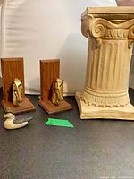 Lot group showing column, pair of horse head bookends, small duck decoy
