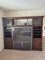 Front view of full wall unit with TV opening and storage